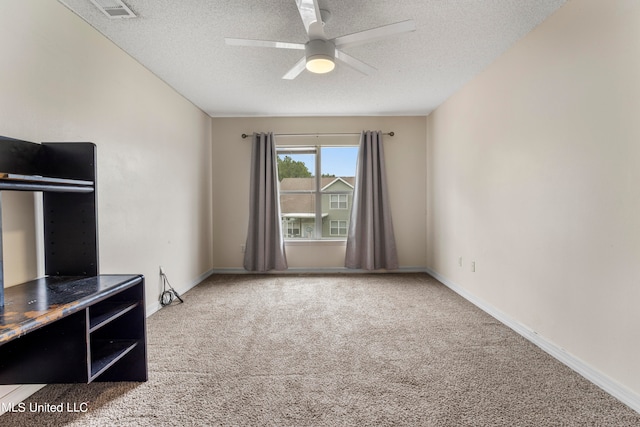 unfurnished living room featuring a textured ceiling, carpet flooring, and ceiling fan