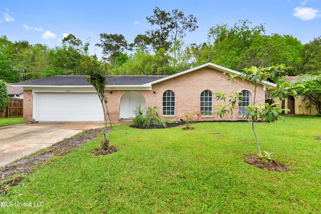 ranch-style house with an attached garage, fence, concrete driveway, brick siding, and a front lawn