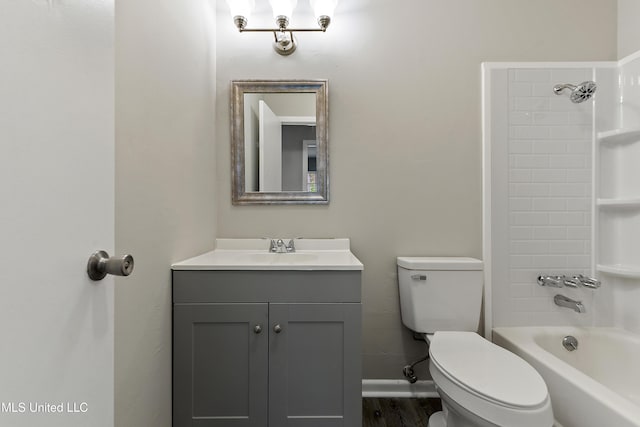 full bathroom featuring vanity, baseboards, bathing tub / shower combination, toilet, and wood finished floors