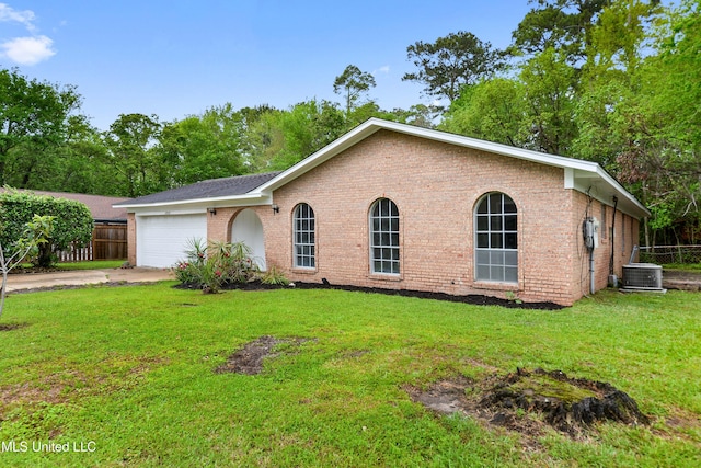 single story home with brick siding, a front yard, fence, and a garage