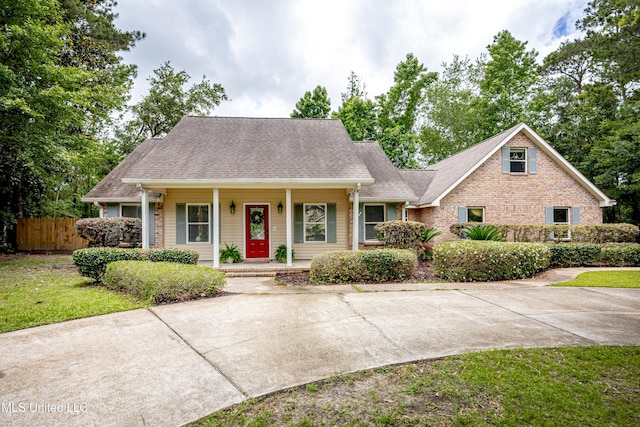 7321 Ieke Cir, Diamondhead, MS 39525 - view of front of home featuring a porch and roof with shingles