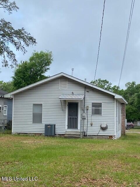 2524 18th Ave, Gulfport, MS 39501 - back of property featuring central AC unit, a yard, and crawl space