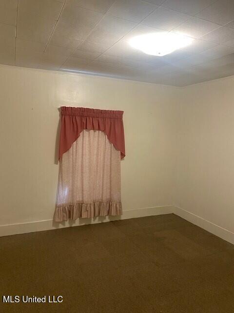 2524 18th Ave, Gulfport, MS 39501 - empty room with dark colored carpet and baseboards