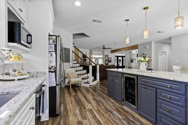 kitchen with visible vents, wine cooler, appliances with stainless steel finishes, dark wood-style floors, and white cabinets