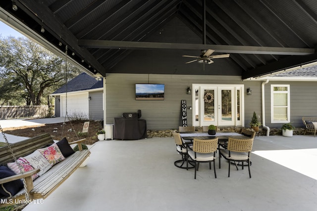 view of patio / terrace with french doors, outdoor dining area, a ceiling fan, and fence