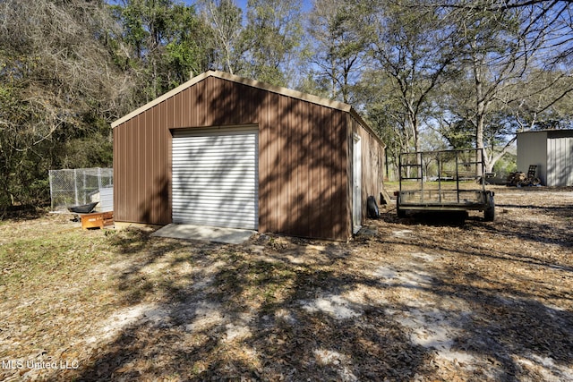 view of outbuilding featuring an outbuilding and dirt driveway