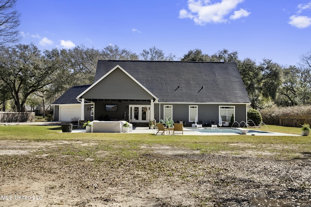 rear view of property with french doors, fence, a fenced in pool, and a patio area