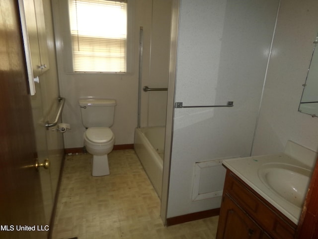 full bath with vanity, toilet, and baseboards