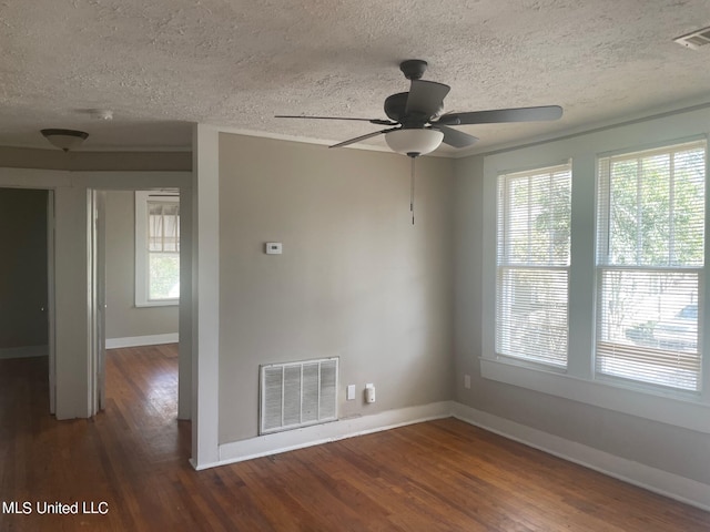 unfurnished room with ceiling fan, a textured ceiling, and dark hardwood / wood-style flooring