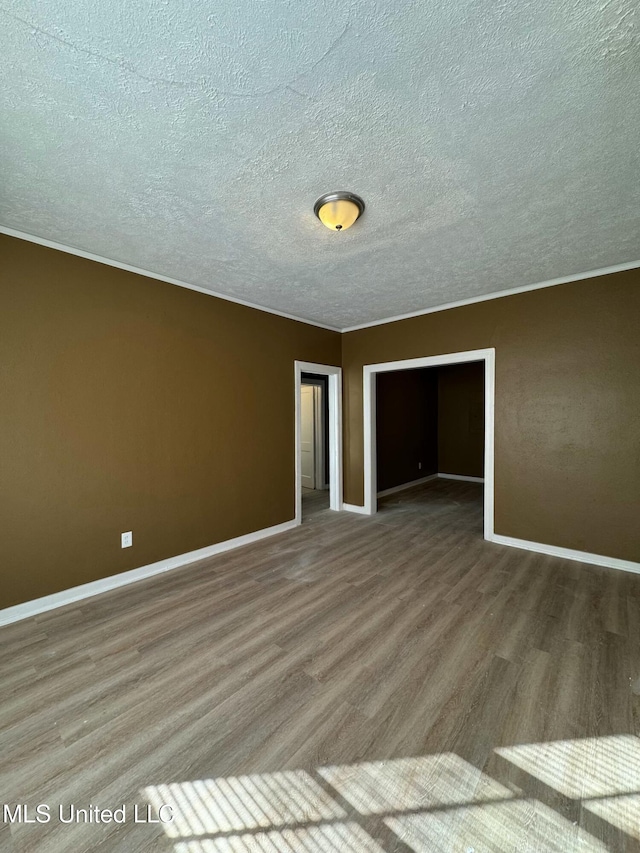 spare room with hardwood / wood-style floors