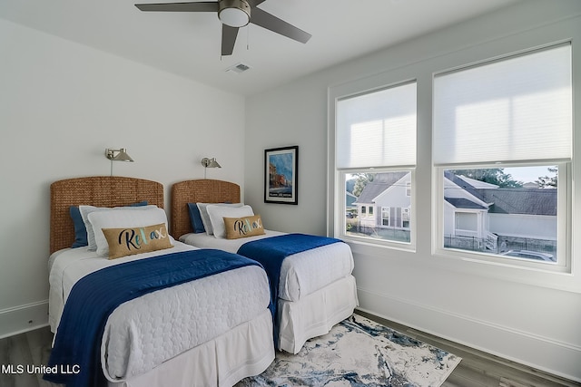 bedroom with hardwood / wood-style flooring and ceiling fan