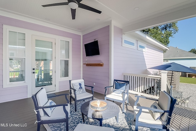 view of patio / terrace with a deck and ceiling fan