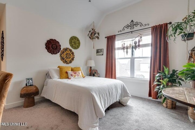 bedroom with carpet and vaulted ceiling