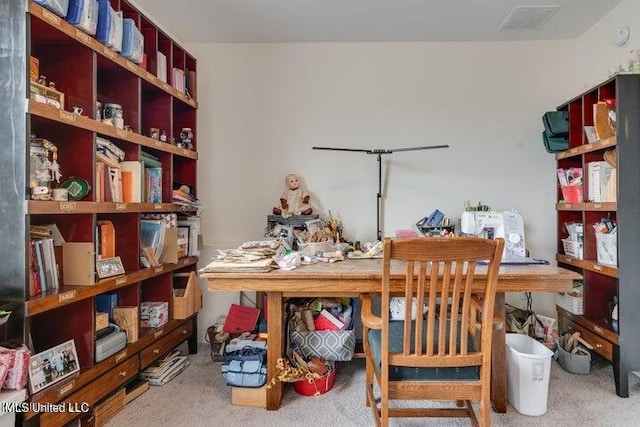 carpeted office space featuring visible vents