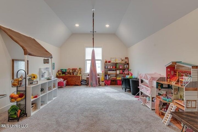 recreation room featuring vaulted ceiling and carpet