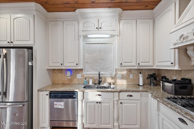 136 Mullherrin Dr, Madison, MS 39110 - kitchen with a sink, appliances with stainless steel finishes, light stone counters, and white cabinetry