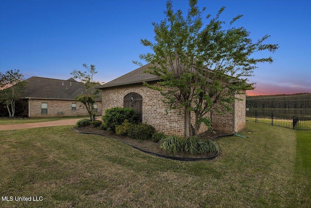 136 Mullherrin Dr, Madison, MS 39110 - view of front of property with a front yard, fence, and brick siding