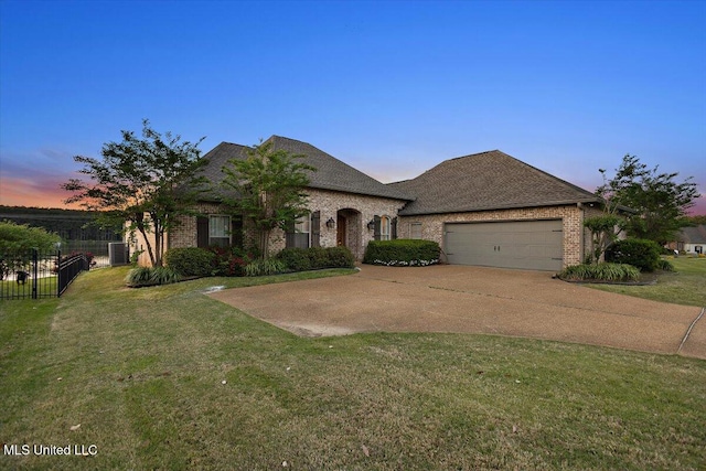 136 Mullherrin Dr, Madison, MS 39110 - french provincial home with a yard, fence, brick siding, an attached garage, and driveway