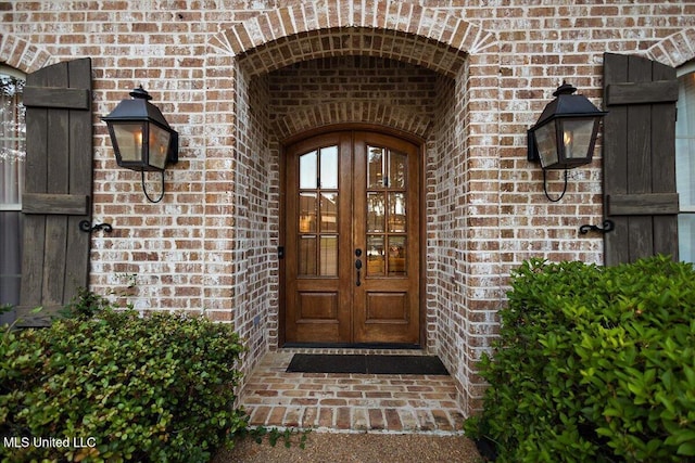 136 Mullherrin Dr, Madison, MS 39110 - view of exterior entry featuring brick siding and french doors