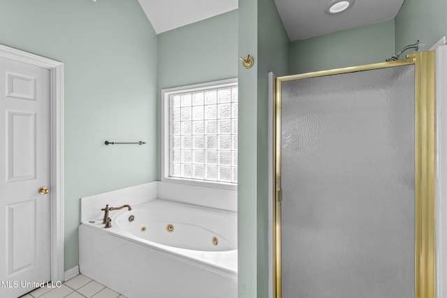 bathroom with a whirlpool tub, a stall shower, and tile patterned floors