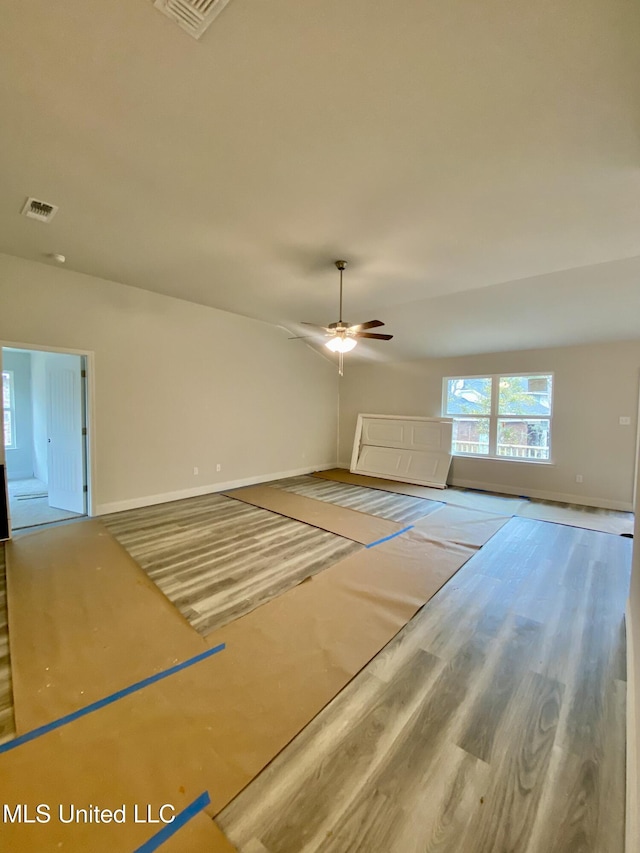 interior space with ceiling fan