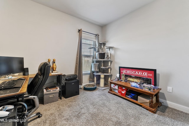 carpeted office space with baseboards