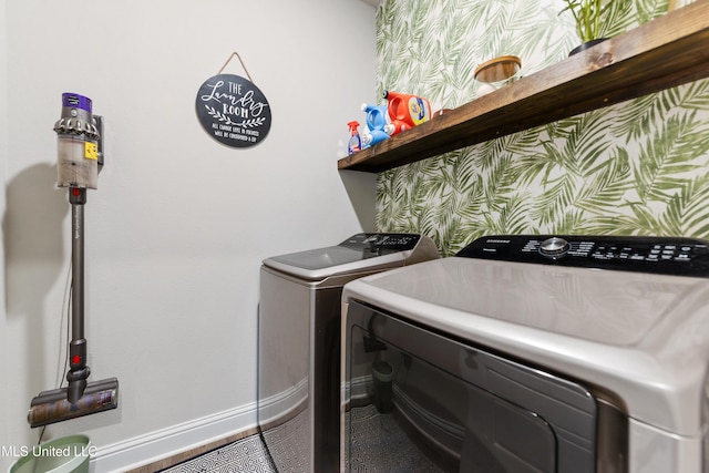 laundry area featuring laundry area, separate washer and dryer, and baseboards