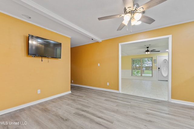 empty room featuring light hardwood / wood-style floors, crown molding, beam ceiling, and ceiling fan