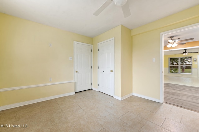 unfurnished bedroom featuring ceiling fan