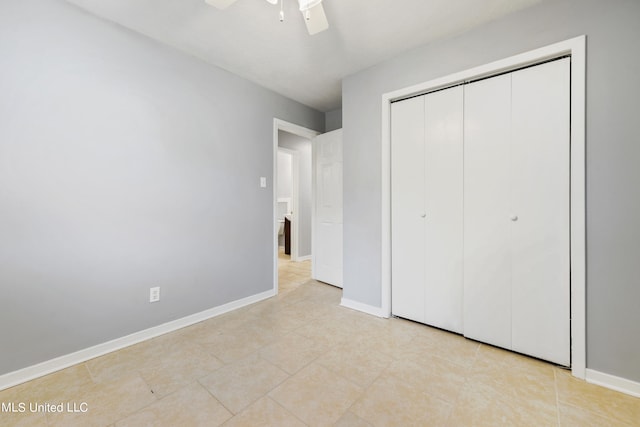 unfurnished bedroom with a closet, ceiling fan, and light tile patterned flooring