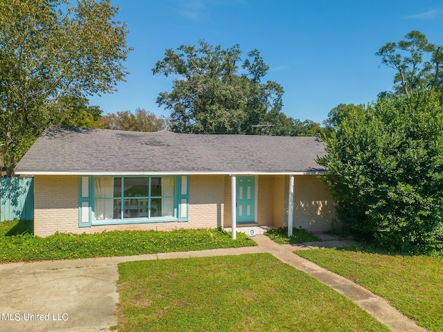 ranch-style house with a front lawn