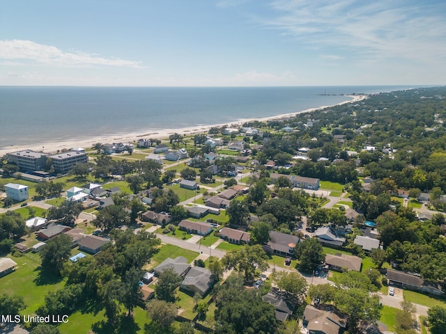 aerial view with a water view and a beach view