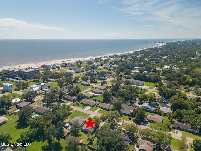 bird's eye view with a water view and a beach view