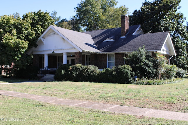 view of front of home with a front lawn and a porch