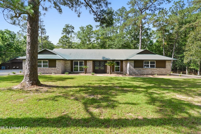 17508 John Cumbest Rd, Moss Point, MS 39562 - single story home featuring french doors, a front lawn, metal roof, and brick siding