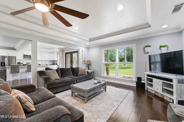 17508 John Cumbest Rd, Moss Point, MS 39562 - living area featuring a raised ceiling, dark wood-type flooring, ceiling fan, recessed lighting, and ornamental molding