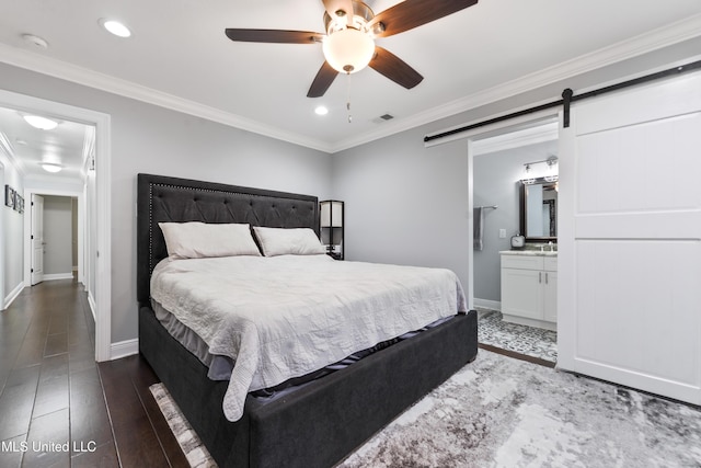 17508 John Cumbest Rd, Moss Point, MS 39562 - bedroom featuring ornamental molding, baseboards, a barn door, recessed lighting, and connected bathroom