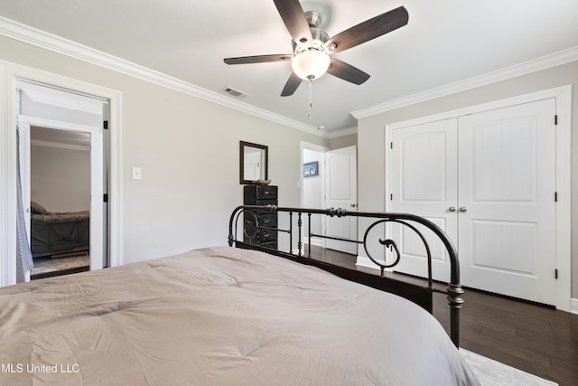 17508 John Cumbest Rd, Moss Point, MS 39562 - bedroom featuring wood finished floors, crown molding, a closet, ceiling fan, and baseboards