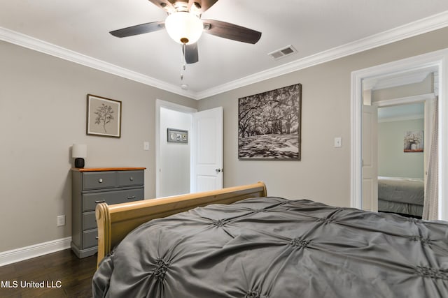 17508 John Cumbest Rd, Moss Point, MS 39562 - bedroom featuring dark wood-style floors, ornamental molding, baseboards, and a ceiling fan