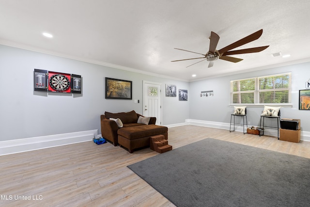 17508 John Cumbest Rd, Moss Point, MS 39562 - living area featuring a ceiling fan, light wood-type flooring, recessed lighting, crown molding, and baseboards