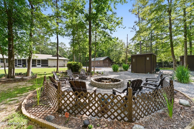 17508 John Cumbest Rd, Moss Point, MS 39562 - view of patio featuring a fire pit