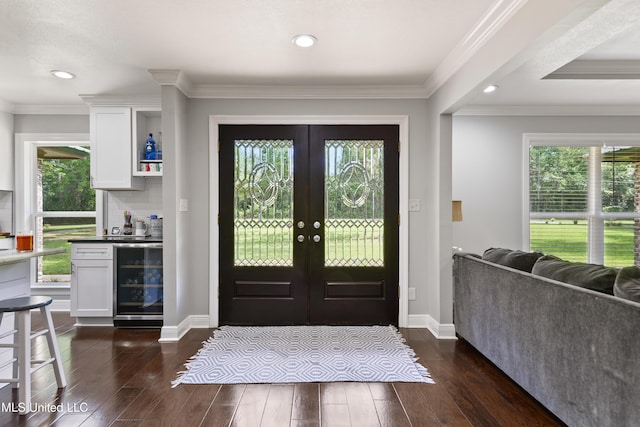 17508 John Cumbest Rd, Moss Point, MS 39562 - entryway featuring beverage cooler, french doors, healthy amount of natural light, dark wood-type flooring, and recessed lighting