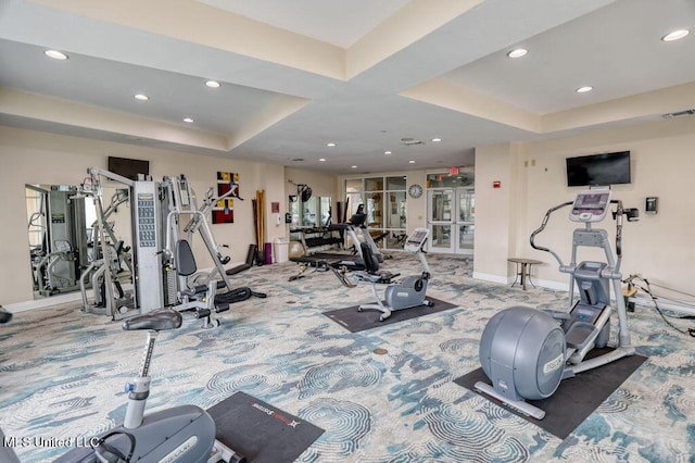 workout area featuring recessed lighting, carpet flooring, a tray ceiling, and visible vents
