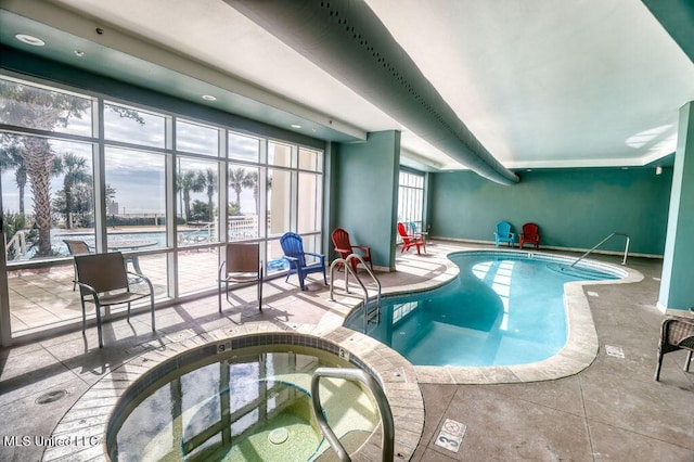 pool with an indoor hot tub