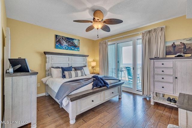 bedroom with access to outside, wood-type flooring, and ceiling fan