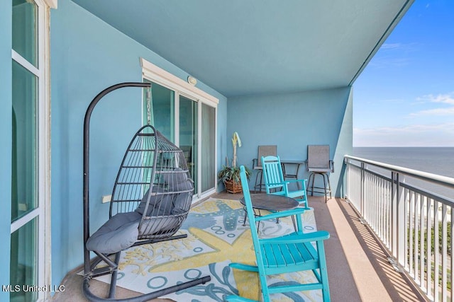balcony featuring a water view