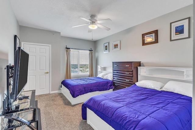 bedroom with baseboards, a ceiling fan, and carpet flooring