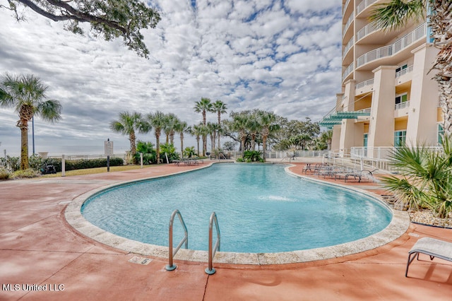 view of pool featuring a patio and pool water feature