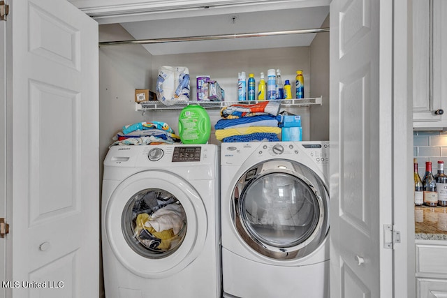 laundry area featuring washing machine and dryer