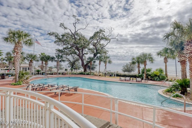 pool with a patio area